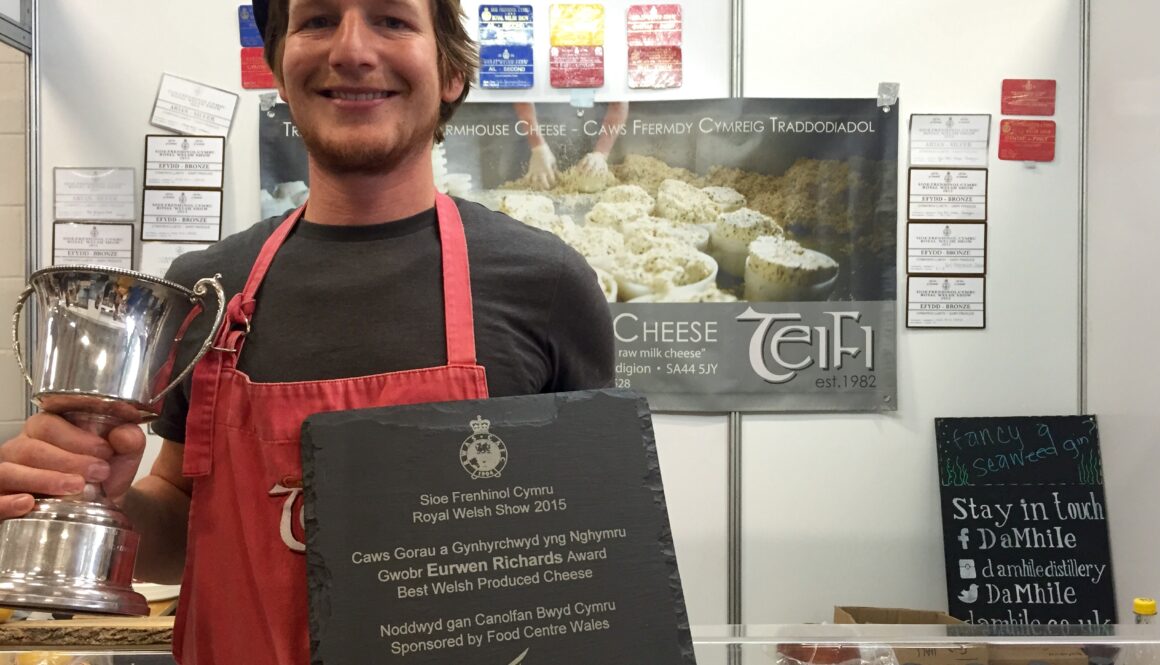 Robert-Jan Savage-Onstwedder from Teifi Cheese receives the Best Welsh Cheese trophy and Supreme Champion Cup at last week's Royal Welsh Show.