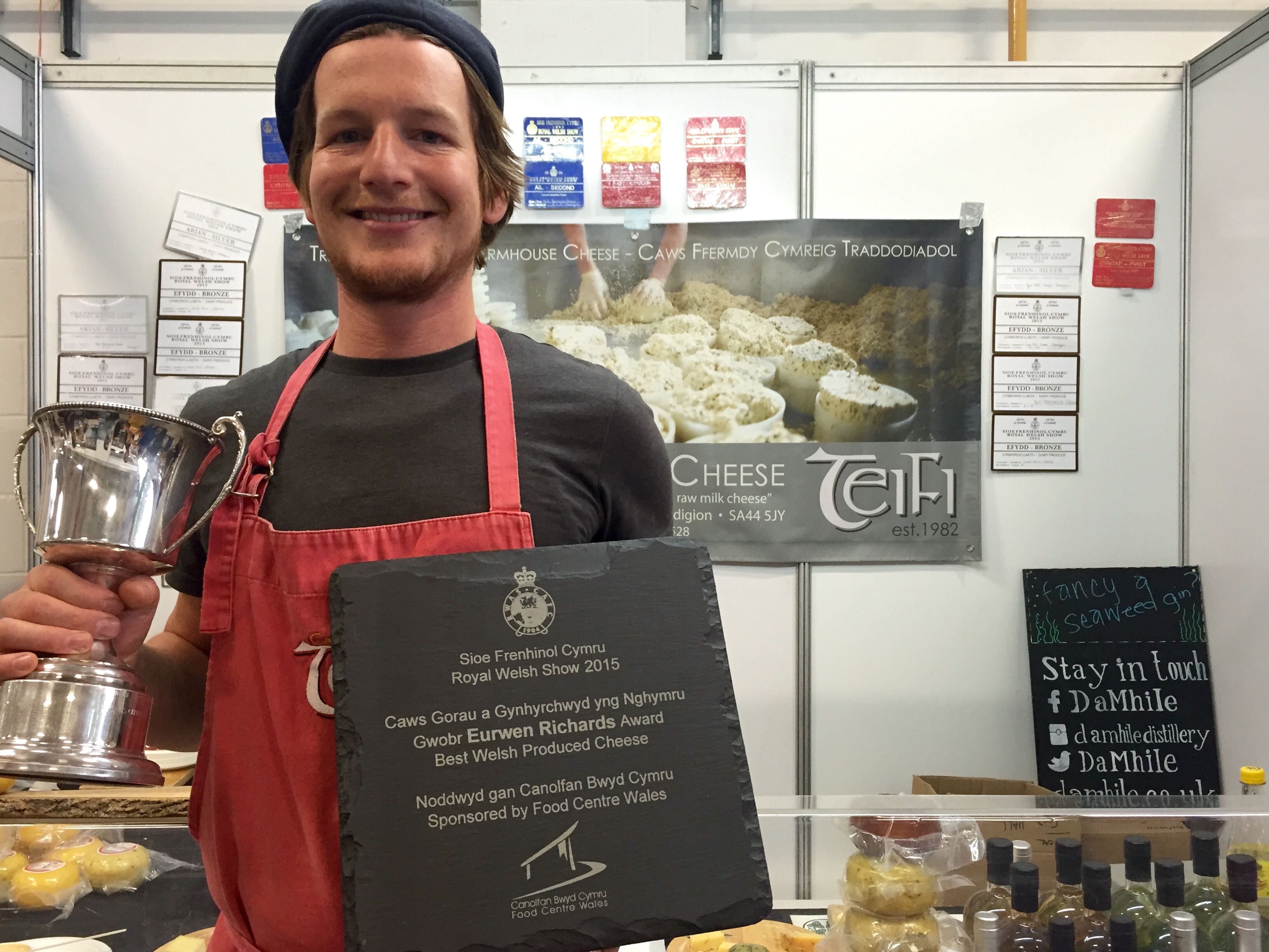 Robert-Jan Savage-Onstwedder from Teifi Cheese receives the Best Welsh Cheese trophy and Supreme Champion Cup at last week's Royal Welsh Show.