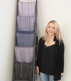 Daisy Fay Ray with her handwoven meditation blankets. 