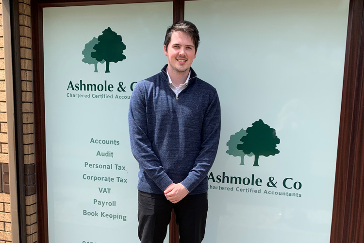 Rhydian Fox outside the Ashmole & Co Swansea office