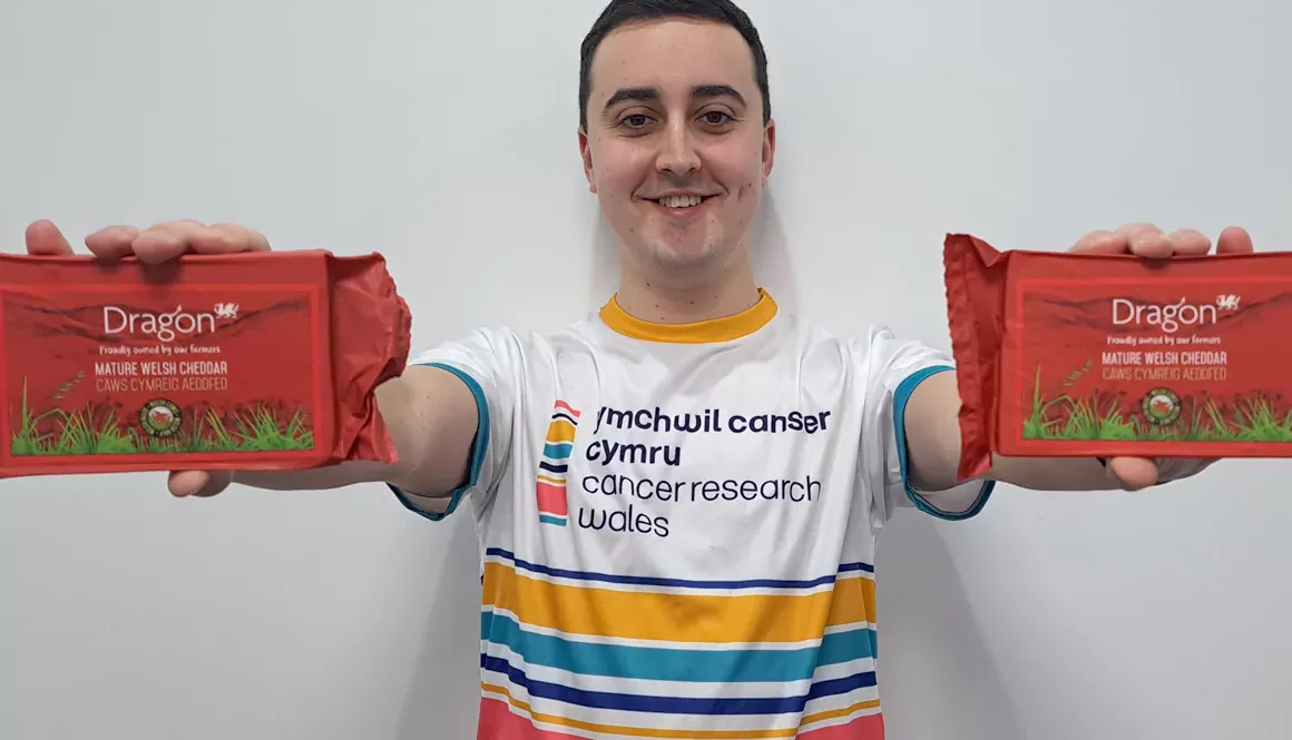 Dr Peter Henley, Cancer Research Wales’s Research Development Officer with SCC’s flagship Dragon cheese
